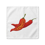 Chili Pepper cloth napkin laid flat, showing two red chili peppers, one split open to the seeds