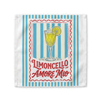 Limoncello Amore Mio cloth napkin, showing a red-framed label with a limoncello coupe on blue and cream stripes