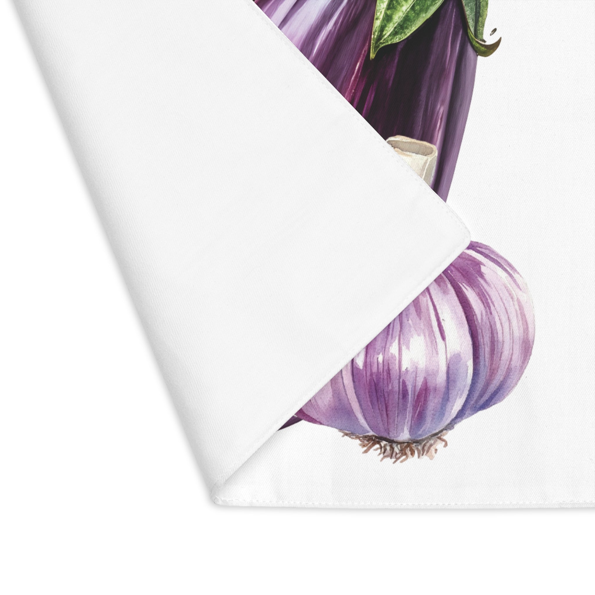 Eggplant and Garlic placemat with one corner turned back, showing the hemmed edge and the plain reverse