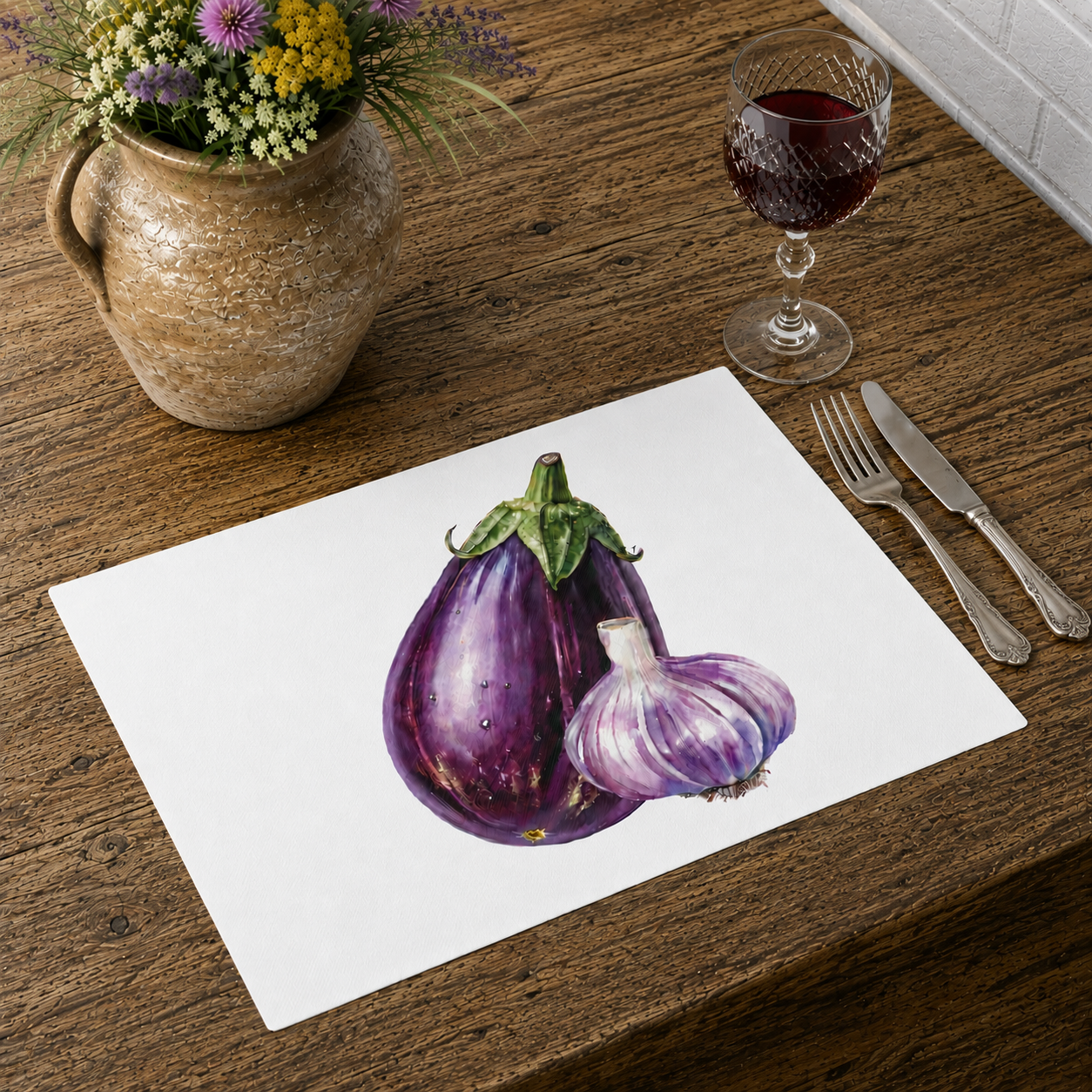 Eggplant and Garlic placemat on a wooden table with cutlery, a wine glass and a vase of dried flowers