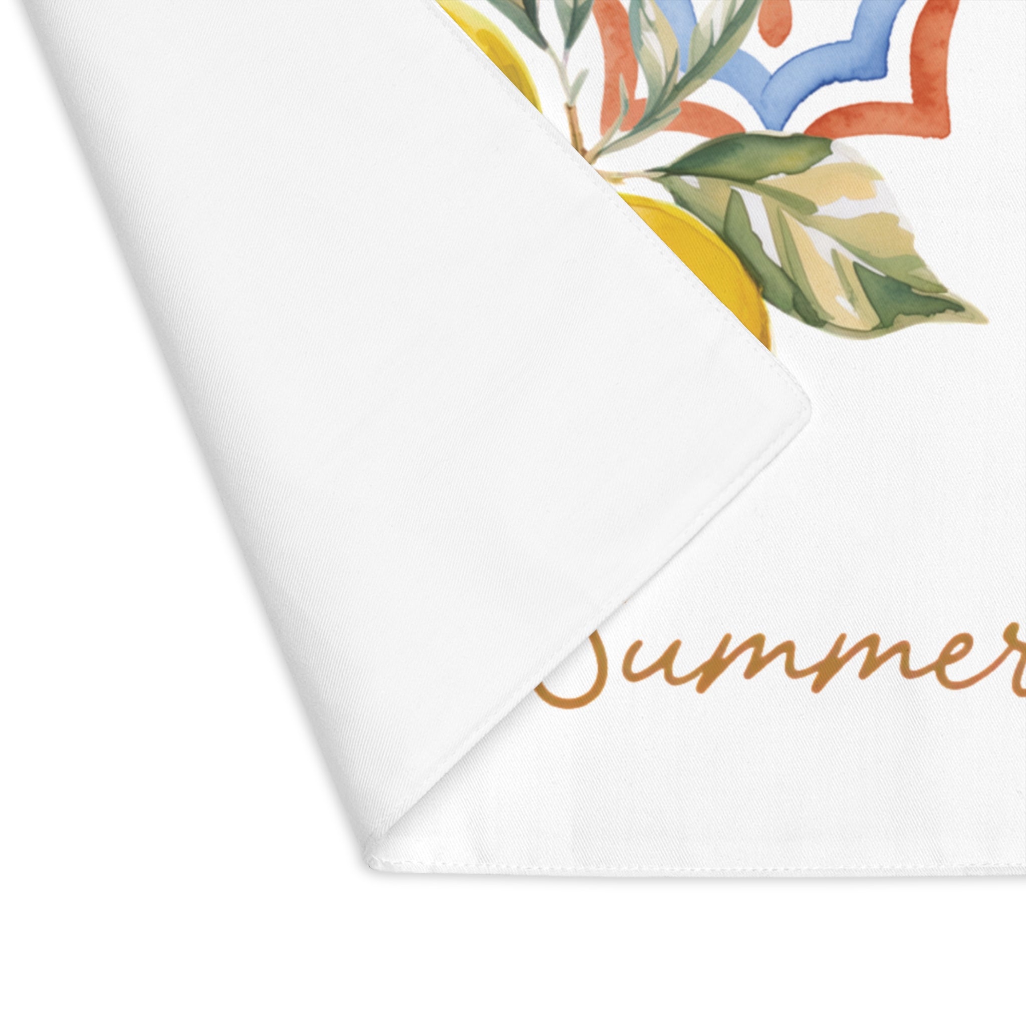 Amalfi Summer placemat with one corner turned back, showing the hemmed edge and the plain reverse