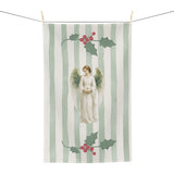Angels and holly Christmas tea towel on a washing line, shown flat with the angel and red-berried holly on a soft green stripe