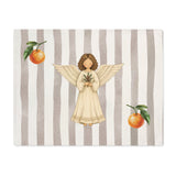 Angels and oranges Christmas placemat laid flat, with the angel and pine sprig on a soft grey stripe and an orange above and below