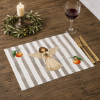Angels and oranges placemat on a dark wooden table with gold cutlery, a glass of red wine and a lit candle