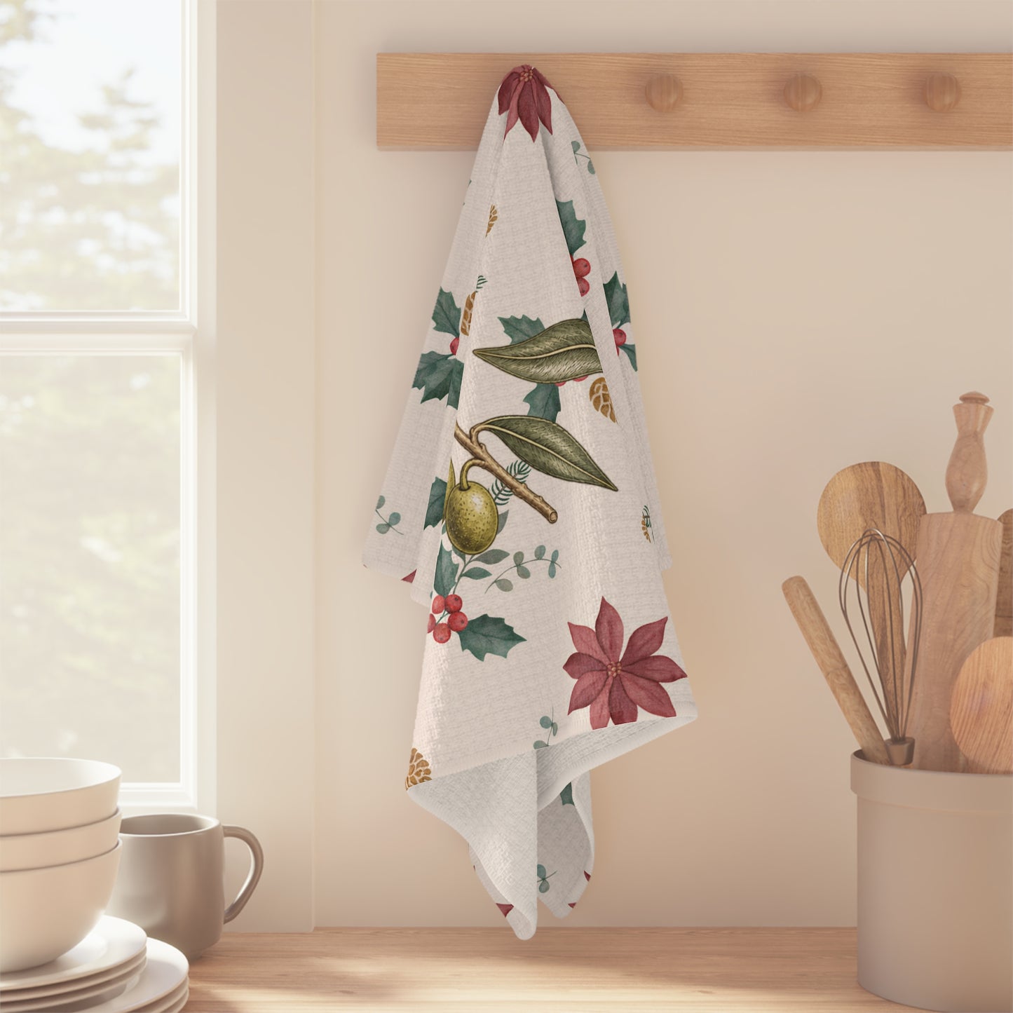 Waffle weave kitchen towel hanging from a peg rail beside a sunlit kitchen window