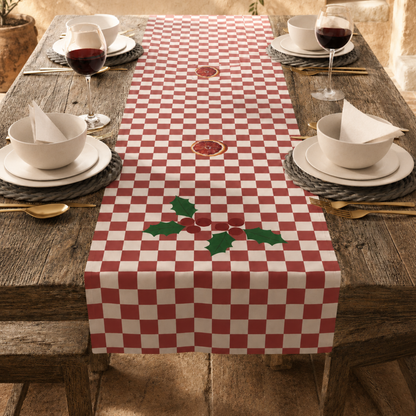 Blood orange check Christmas table runner on a laid table, seen along its length