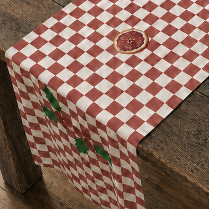 Blood orange check Christmas table runner down a table laid for Christmas dinner