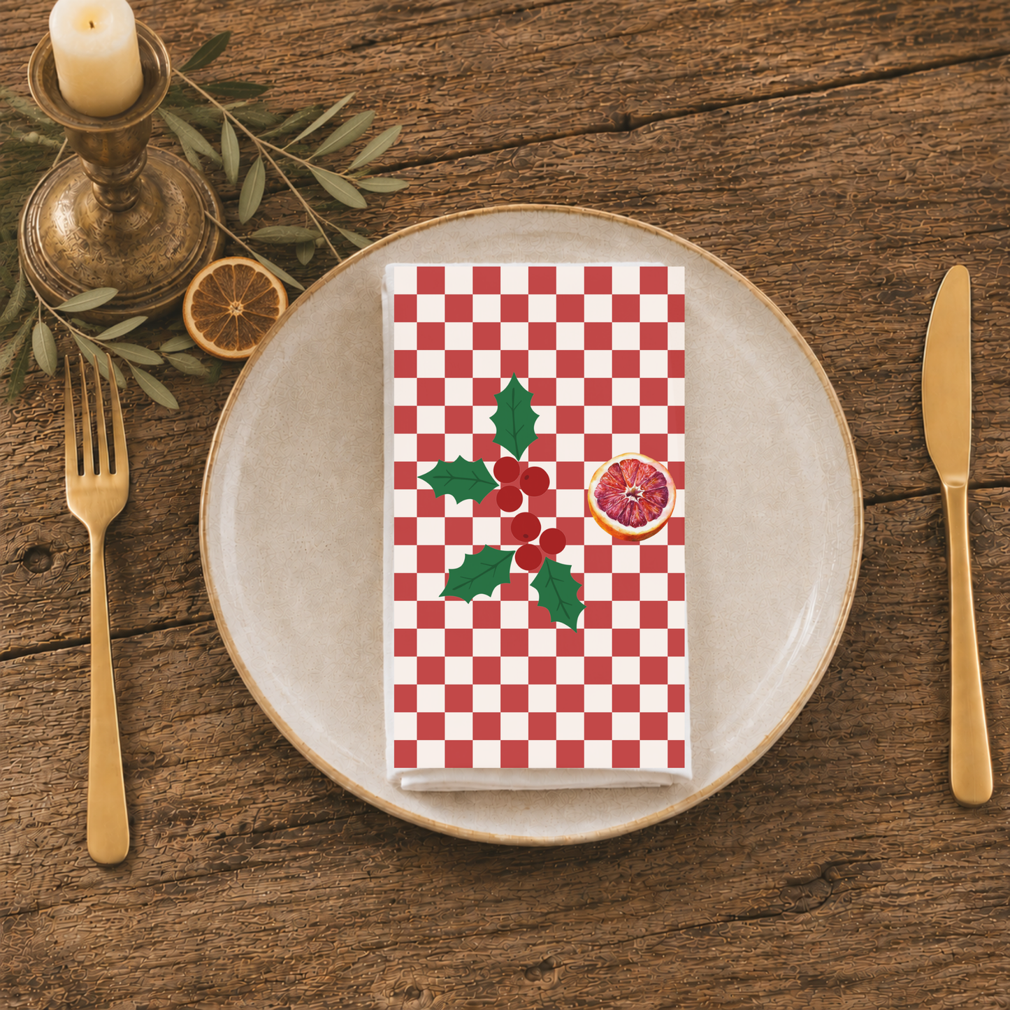 Blood orange check Christmas napkin folded on a plate at a table laid for Christmas