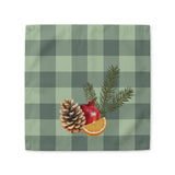 Pomegranate & Pine Gingham Christmas cloth napkin, a pomegranate, pine cone, orange slice and gold star under a pine spray on a sage green gingham check