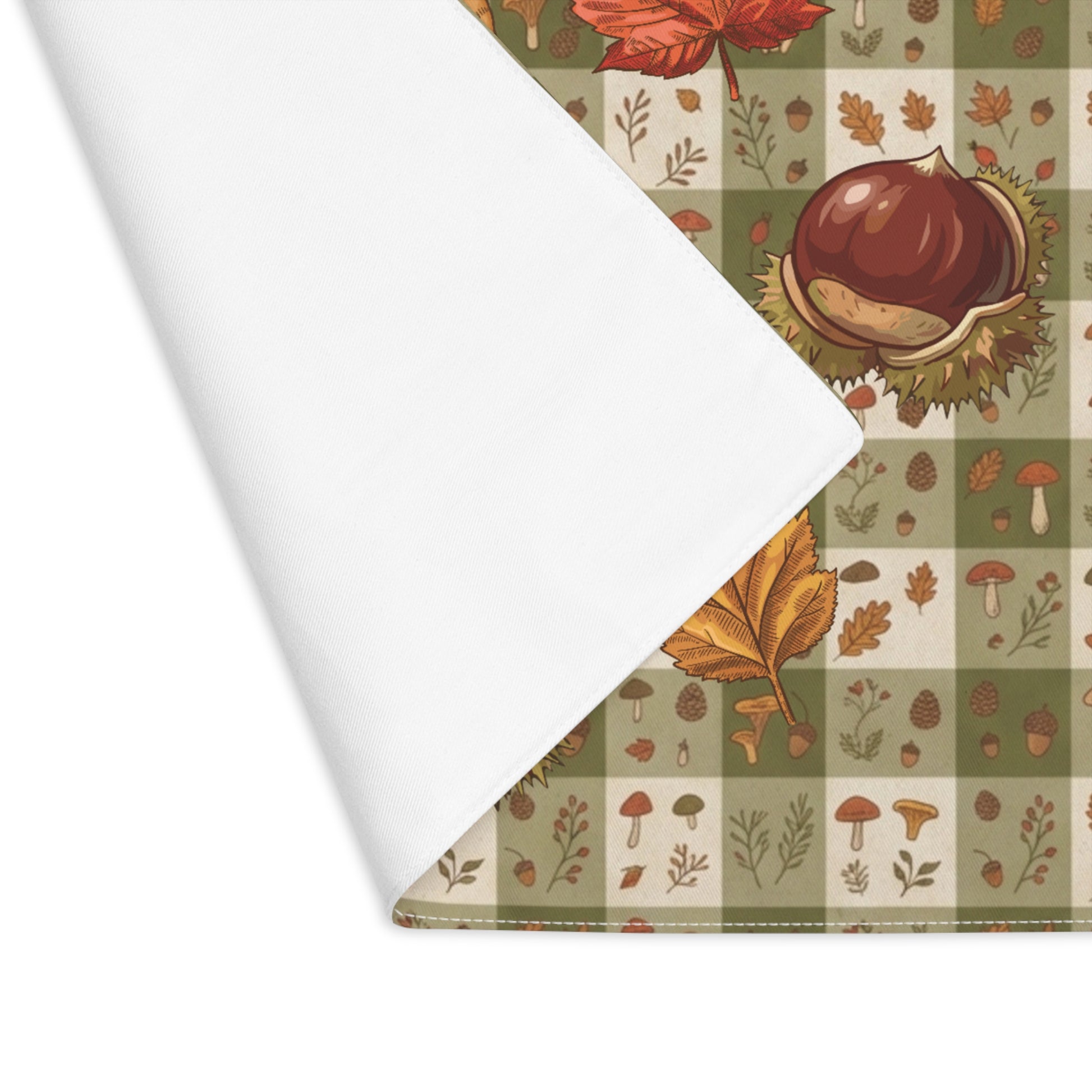 Chestnut & Mushroom fall placemat, acorns and autumn leaves on a green check, at a laid place setting
