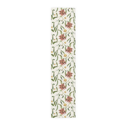 Poinsettia & Mistletoe Christmas table runner, red poinsettias and mistletoe on cream, on a laid dining table