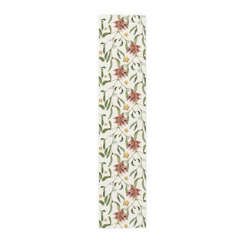 Poinsettia & Mistletoe Christmas table runner, red poinsettias and mistletoe on cream, on a laid dining table