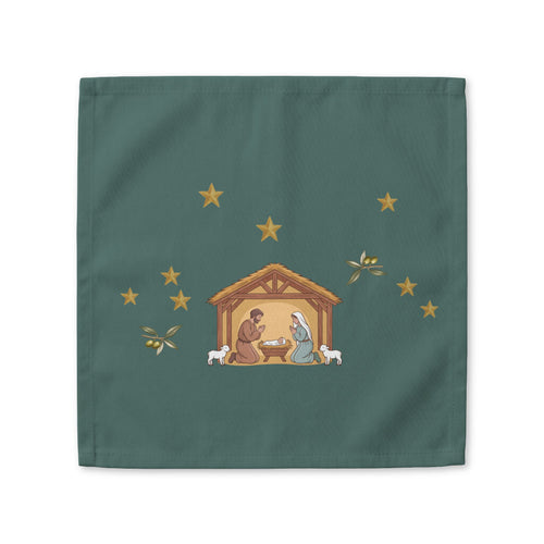 Nativity & Olive Christmas cloth napkin shown flat, a nativity stable with gold stars and olive sprigs on deep green