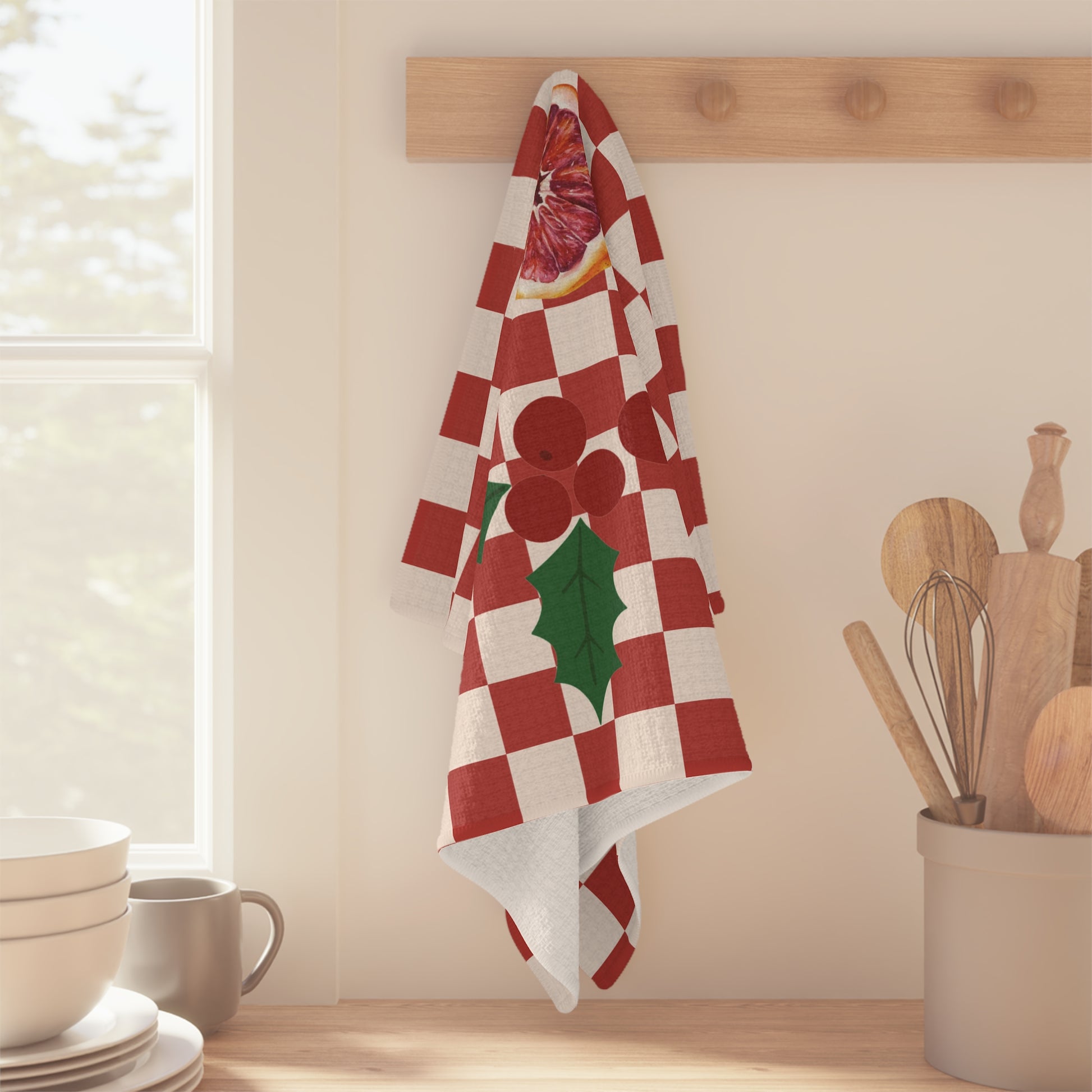 Blood orange check Christmas kitchen towel shown flat, the checkerboard running to the hemmed edge