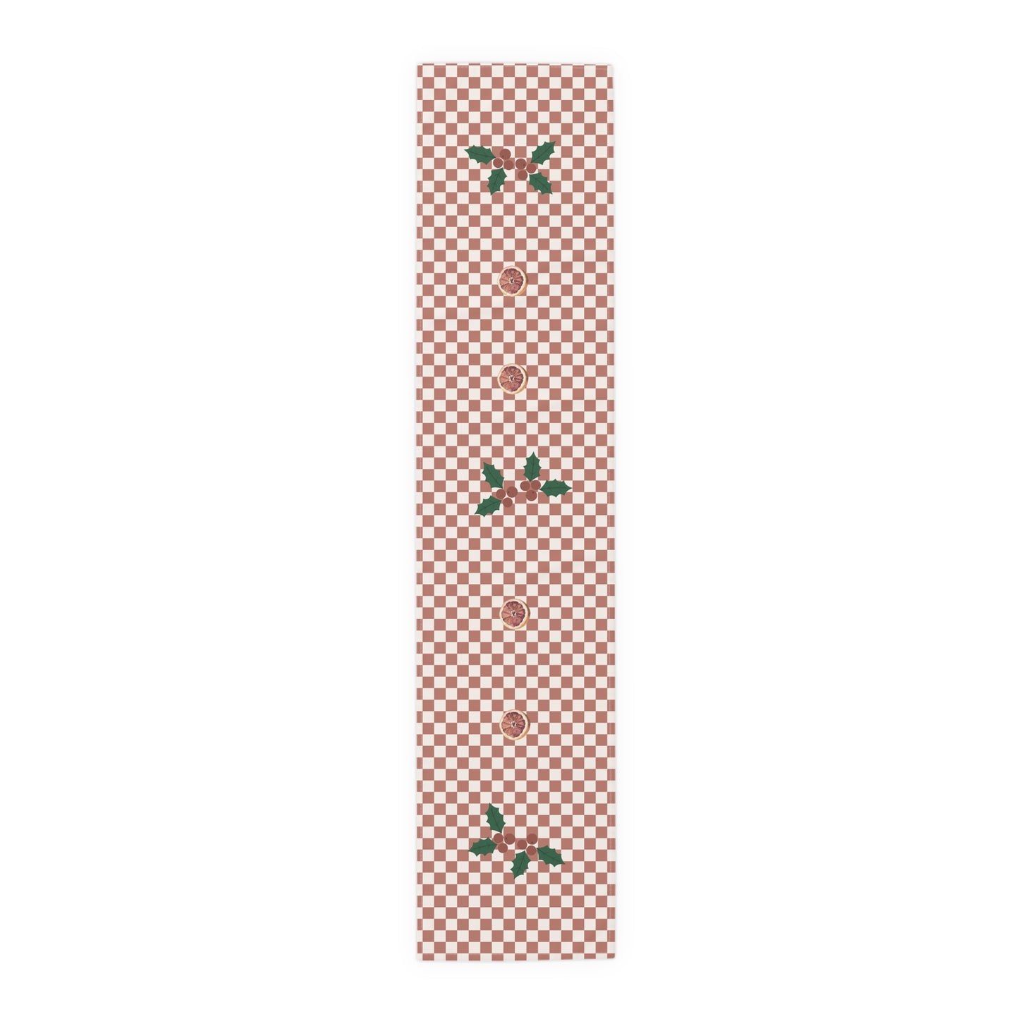 Blood orange check Christmas table runner laid flat, a red and cream checkerboard with holly and a cut blood orange
