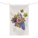 Fig & Grape fall tea towel, watercolour figs and grapes on cream, hanging in a kitchen