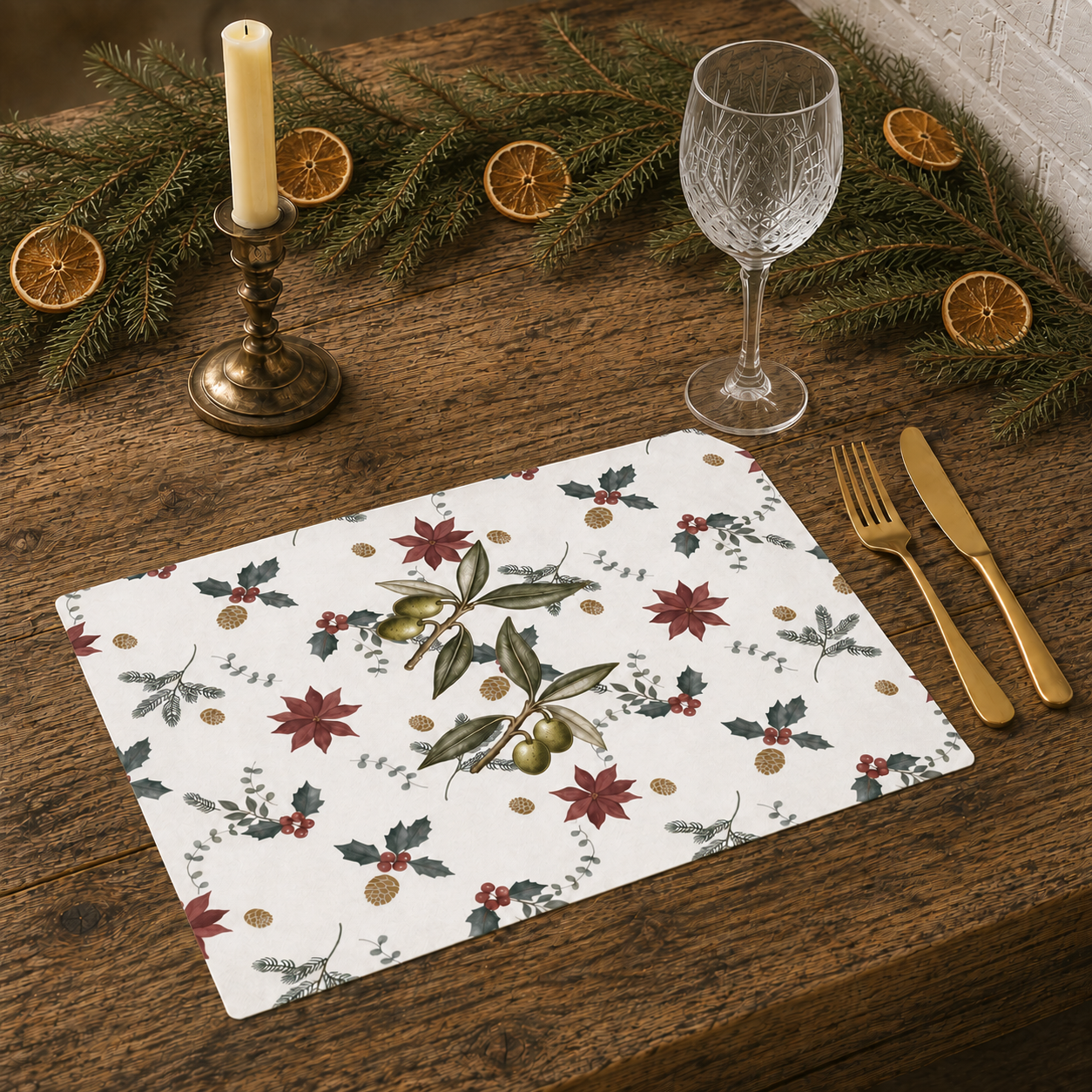 Poinsettia and olive Christmas placemat on a table laid for Christmas dinner, with the poinsettias and olive branches in view