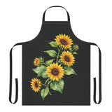 Sunflower apron laid flat, showing the sunflower bouquet print on a black body