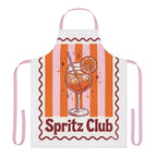 Spritz Club apron laid flat, showing the pink and orange stripes with the Spritz Club cocktail motif