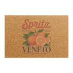 Spritz Veneto coir doormat seen from above on a plain background, showing the Spritz Veneto label print with oranges on natural coir