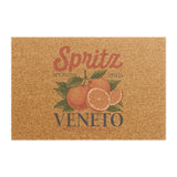 Spritz Veneto coir doormat seen from above on a plain background, showing the Spritz Veneto label print with oranges on natural coir