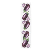Eggplant and Garlic table runner in cotton twill, 16 by 72 inches, laid flat with a repeating eggplant and garlic pattern