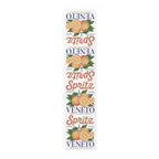 Spritz Veneto table runner, 16 by 72 inches in cotton twill, laid flat showing the repeating Spritz Veneto label print with oranges on a white ground