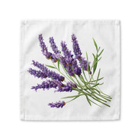 Lavender cloth napkin laid flat, showing a watercolor bundle of lavender stems in flower on white cotton