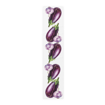 Eggplant and Garlic table runner in polyester, 16 by 72 inches, laid flat with a repeating eggplant and garlic pattern