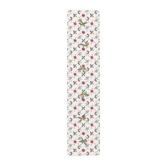 Poinsettia and olive Christmas table runner laid flat, showing poinsettias, red holly berries, gold pine cones and olive branches on cream