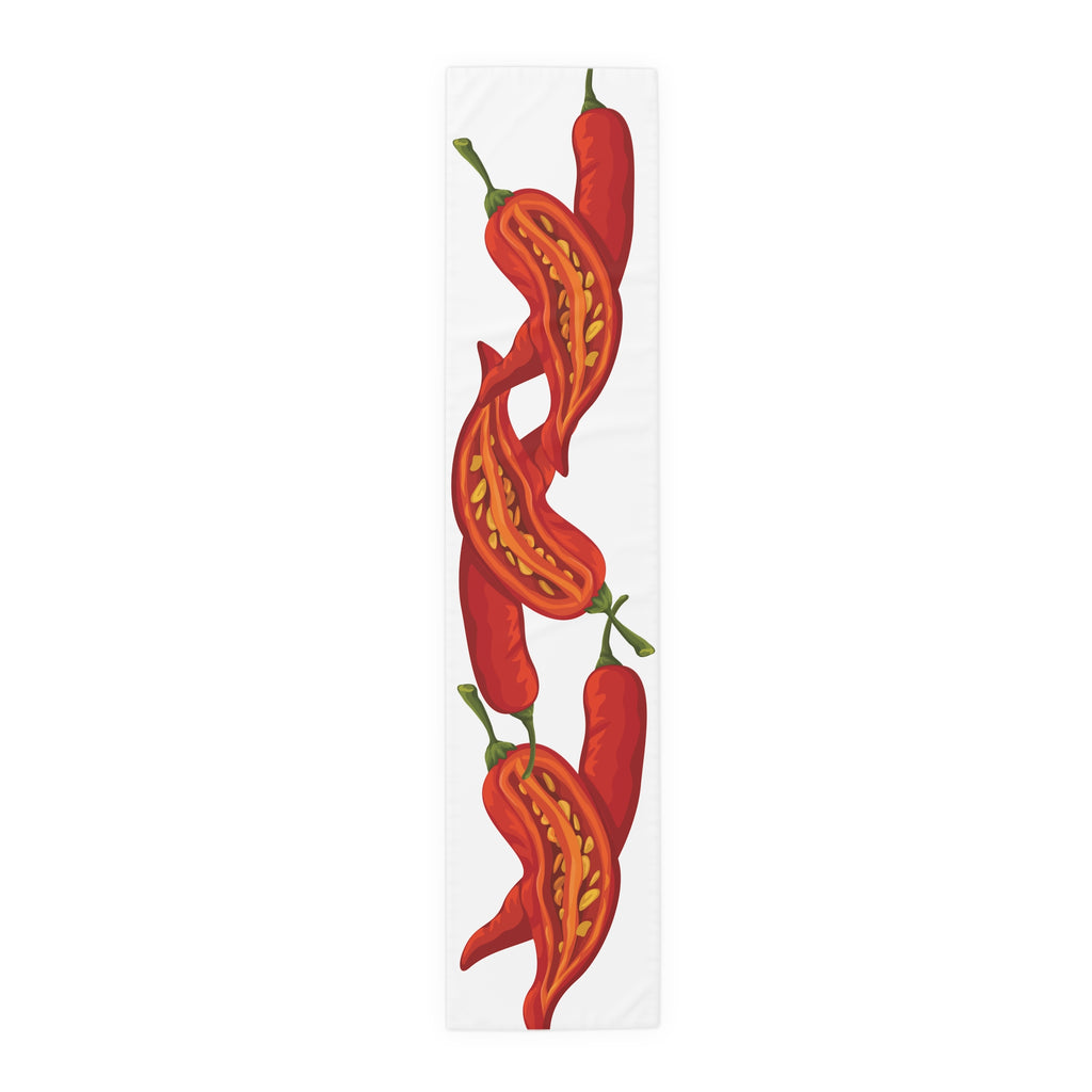 Chili Pepper table runner in polyester, 16 by 72 inches, laid flat with a repeating red chili pepper pattern