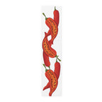 Chili Pepper table runner in polyester, 16 by 72 inches, laid flat with a repeating red chili pepper pattern
