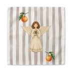 Angels and oranges Christmas cloth napkin laid flat, the angel and oranges centered on the same soft grey and cream stripe