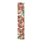 Tomato table runner in cotton twill, 16 by 90 inches, the longer size laid flat with the same repeating print