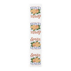 Spritz Veneto table runner, 16 by 90 inches in cotton twill, laid flat showing the repeating Spritz Veneto label print with oranges on a white ground