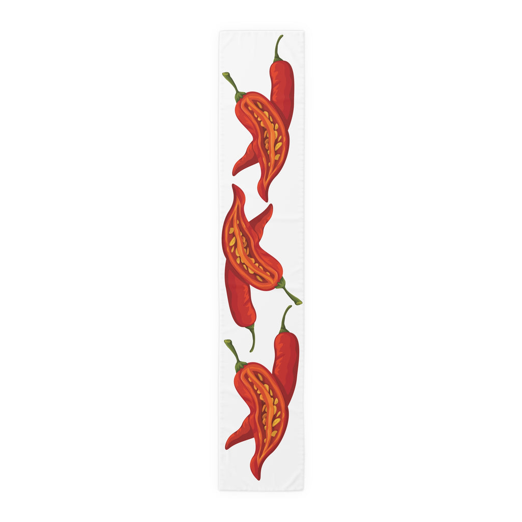 Chili Pepper table runner in polyester, 16 by 90 inches, the longer size laid flat with the same repeating print
