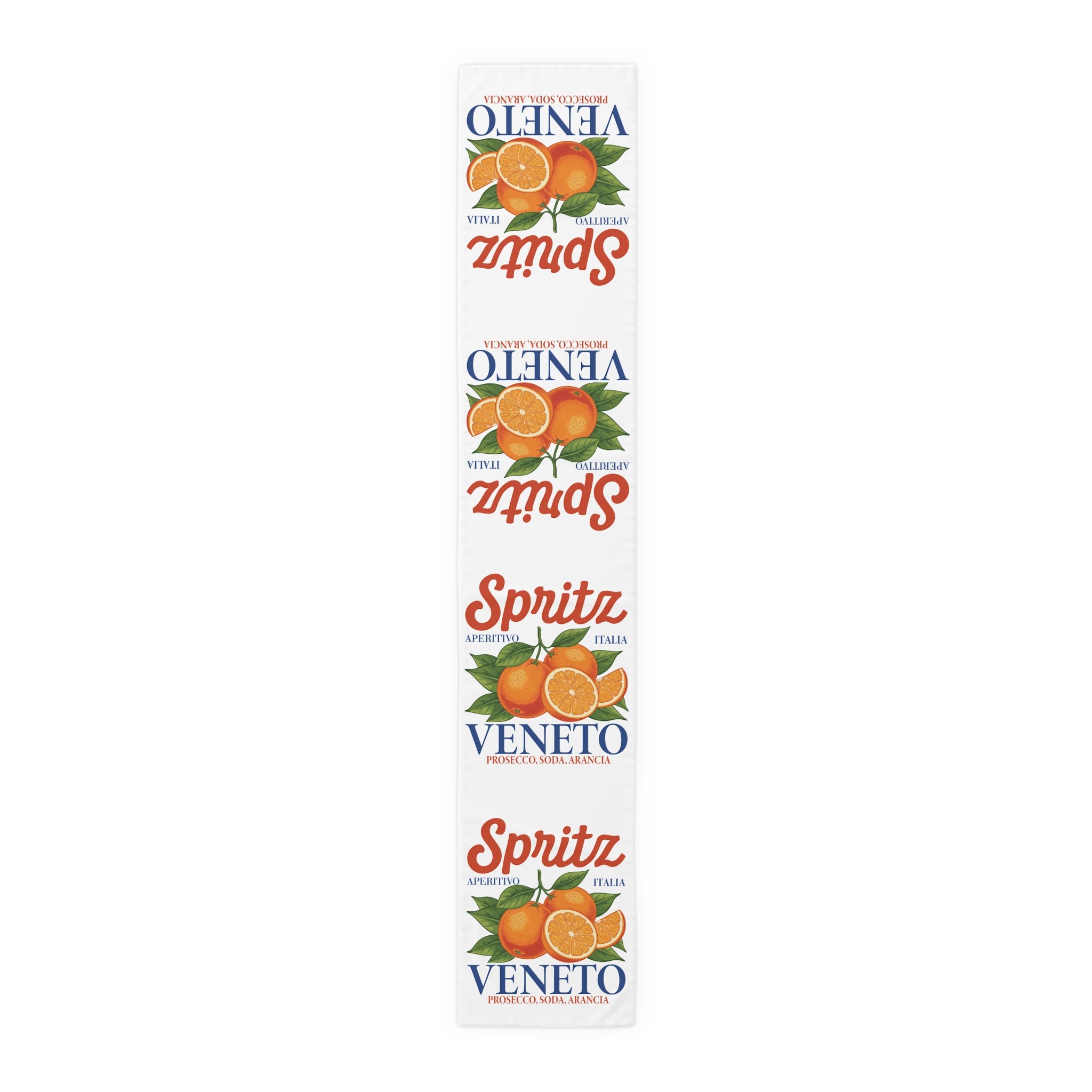 Spritz Veneto table runner, 16 by 90 inches in polyester, laid flat showing the repeating Spritz Veneto label print with oranges on a white ground
