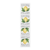 Limoncello table runner in cotton twill, 16 by 72 inches, laid flat with repeating lemon labels and Limoncello lettering