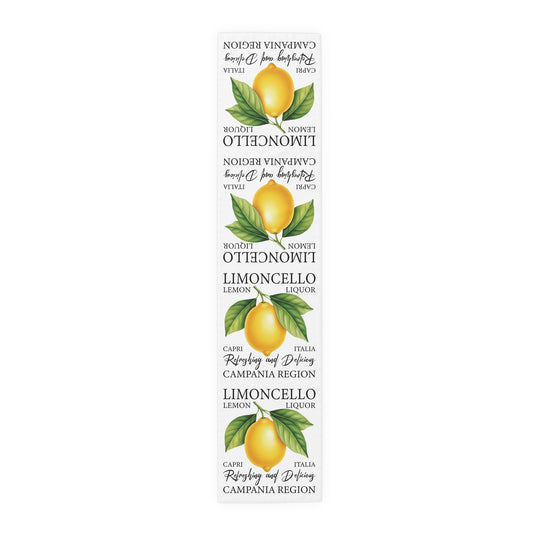 Limoncello table runner in polyester, 16 by 72 inches, laid flat with repeating lemon labels and Limoncello lettering