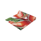 Tomato table runner folded, showing the vine tomato print up close and the hemmed edge