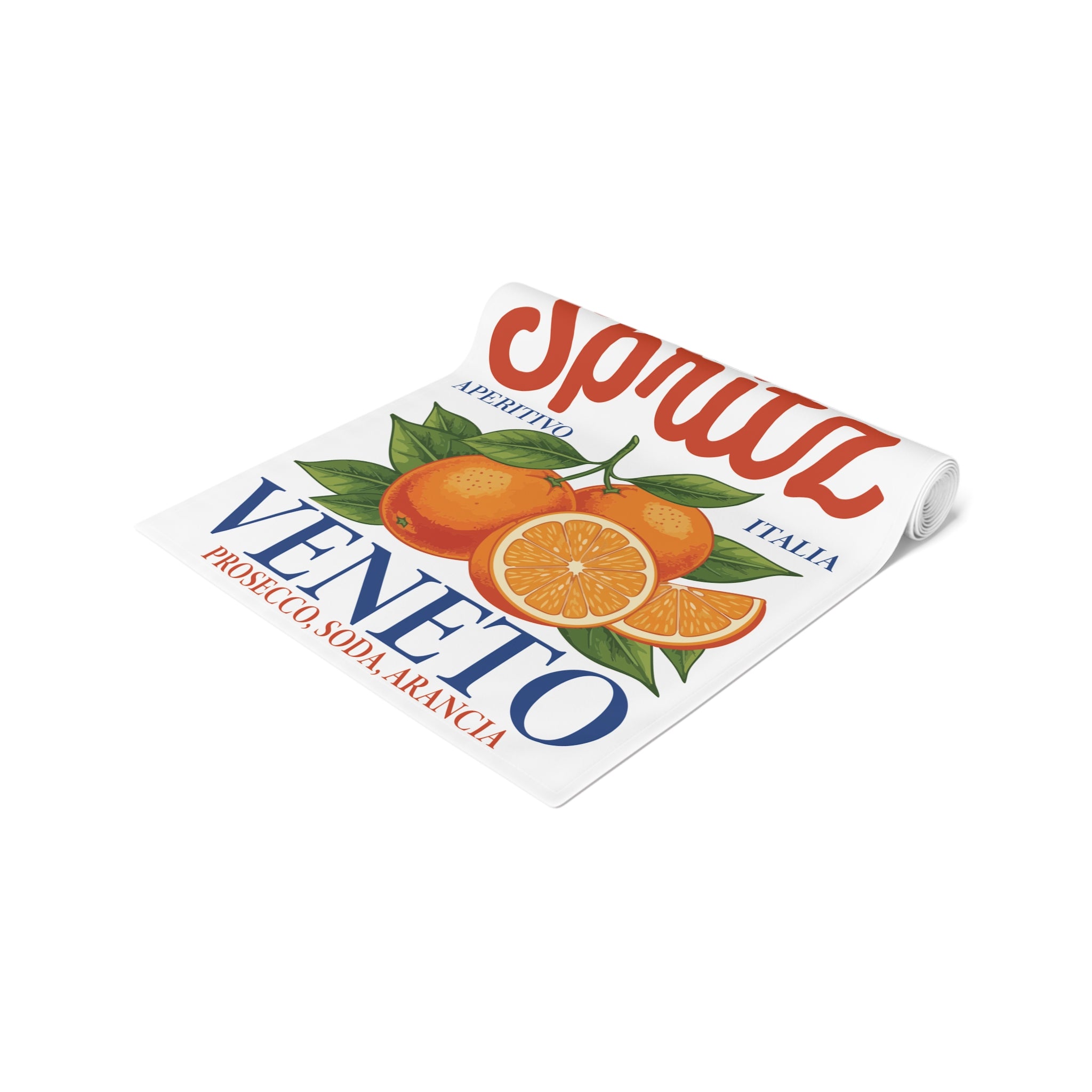 Spritz Veneto table runner rolled up, showing the printed surface and the hemmed edge
