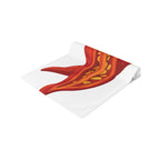 Chili Pepper table runner folded, showing the red chili pepper print up close and the hemmed edge