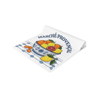 Marché Provençal table runner folded, showing the citrus and blue tile border up close