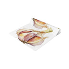 Garlic table runner folded, showing the watercolor garlic print up close and the hemmed edge
