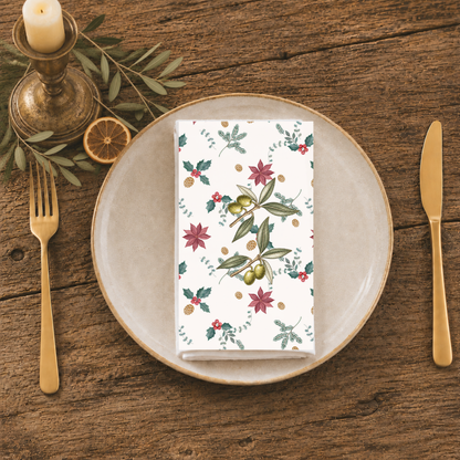 Poinsettia and olive Christmas napkin on a set table, poinsettias and olive branches in view