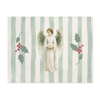 Angels and holly Christmas placemat laid flat, with the angel between two sprigs of red-berried holly on a soft green stripe