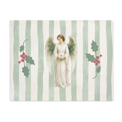 Angels and holly Christmas placemat laid flat, with the angel between two sprigs of red-berried holly on a soft green stripe