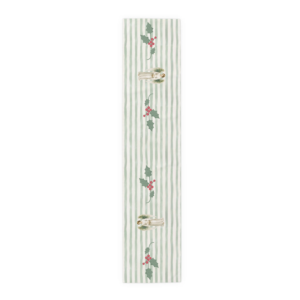 Angels and holly table runner, 72 inch in polyester, laid flat to show the angels and holly on a soft green stripe