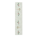 Angels and holly table runner, 72 inch in polyester, laid flat to show the angels and holly on a soft green stripe