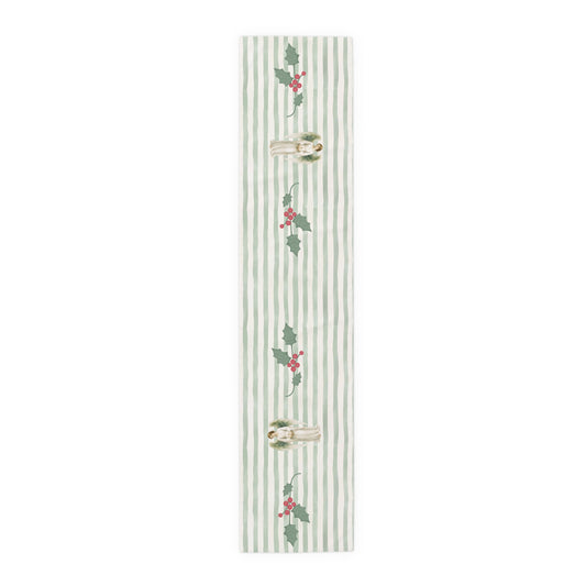 Angels and holly table runner, 72 inch in polyester, laid flat to show the angels and holly on a soft green stripe